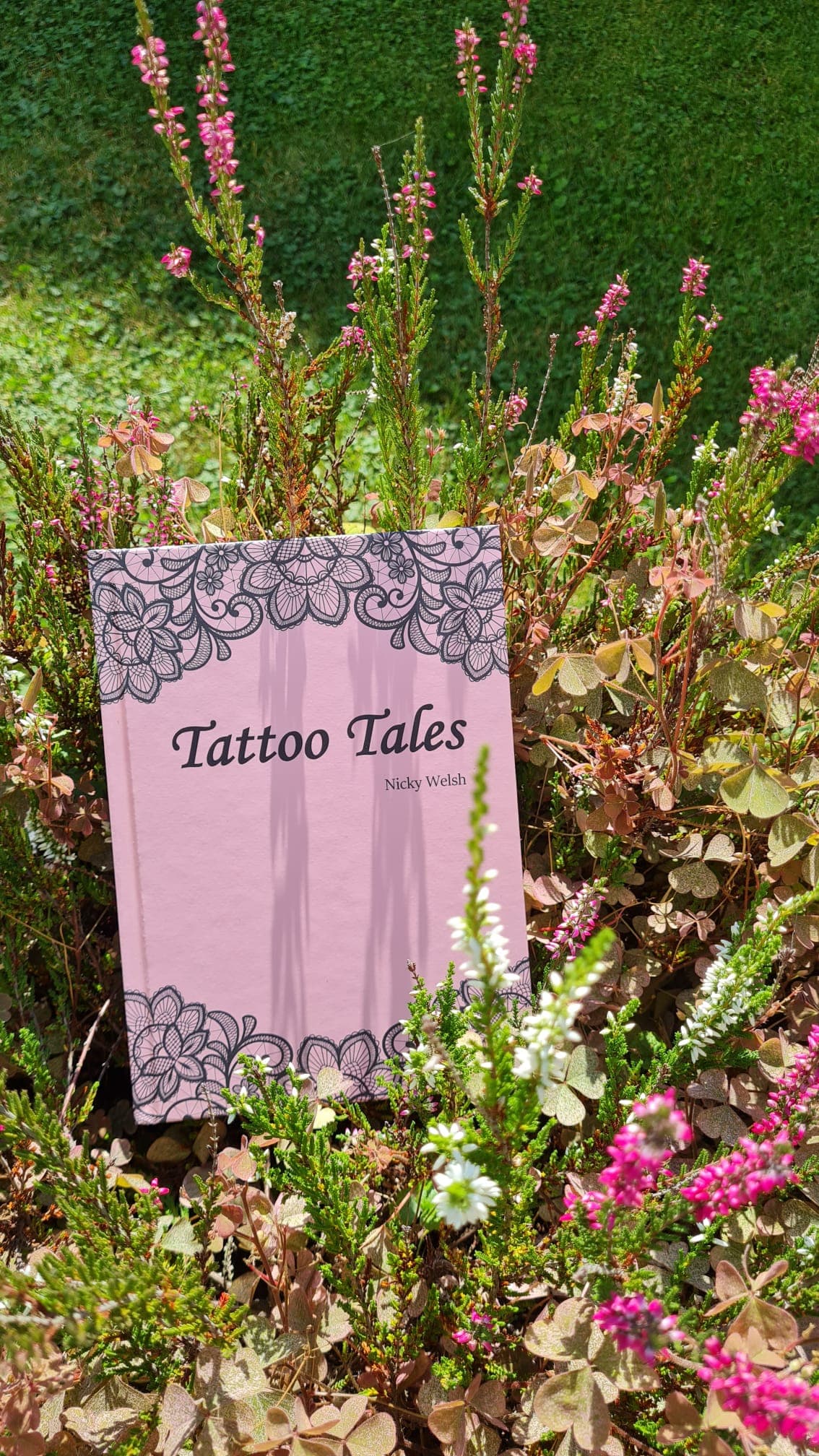 The book standing in a bed of flowering pink heather