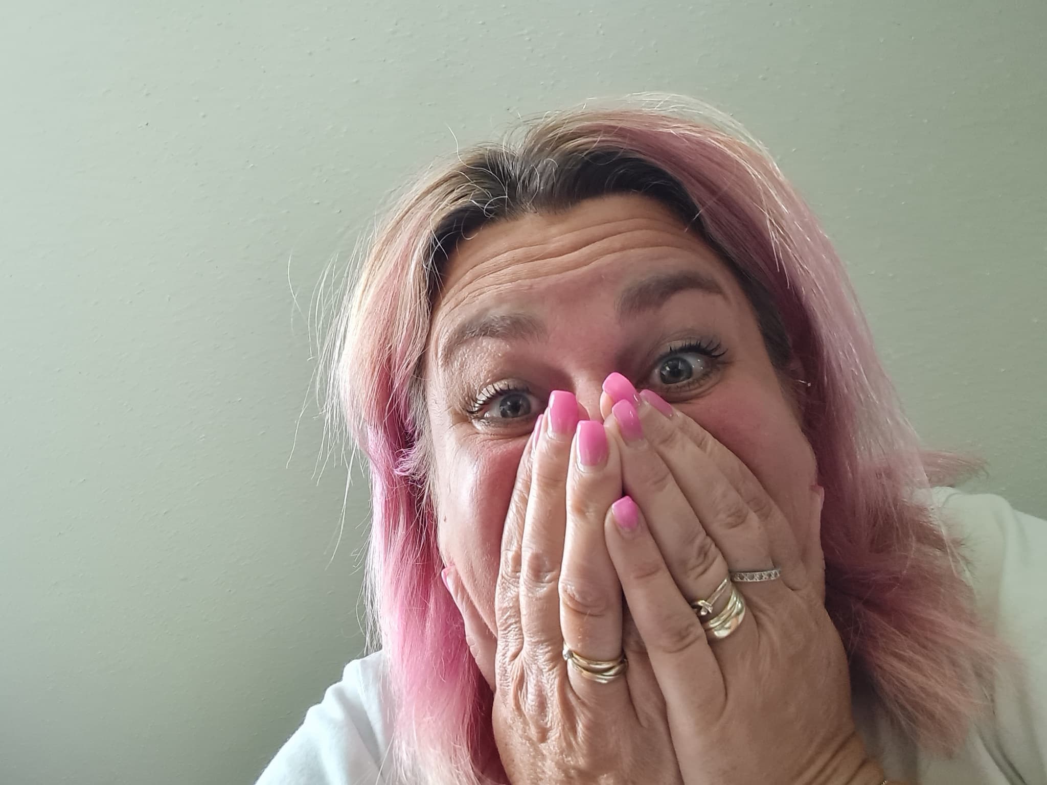 Nicky Welsh holding her hands to her face in surprise